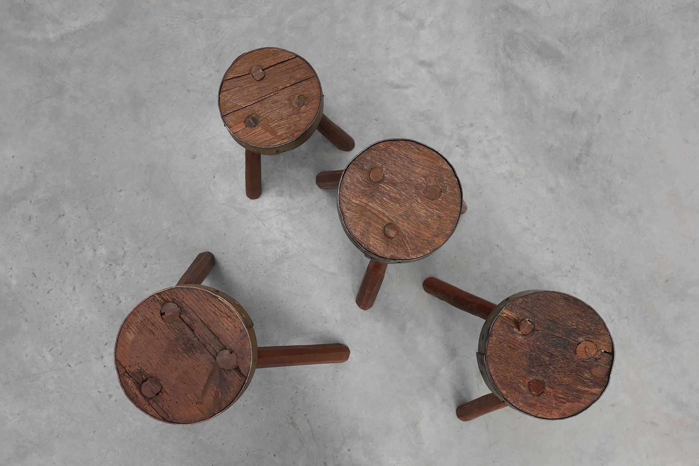 Brutalist French 1850s solid oak tripod stools with metal rim, set of 4thumbnail